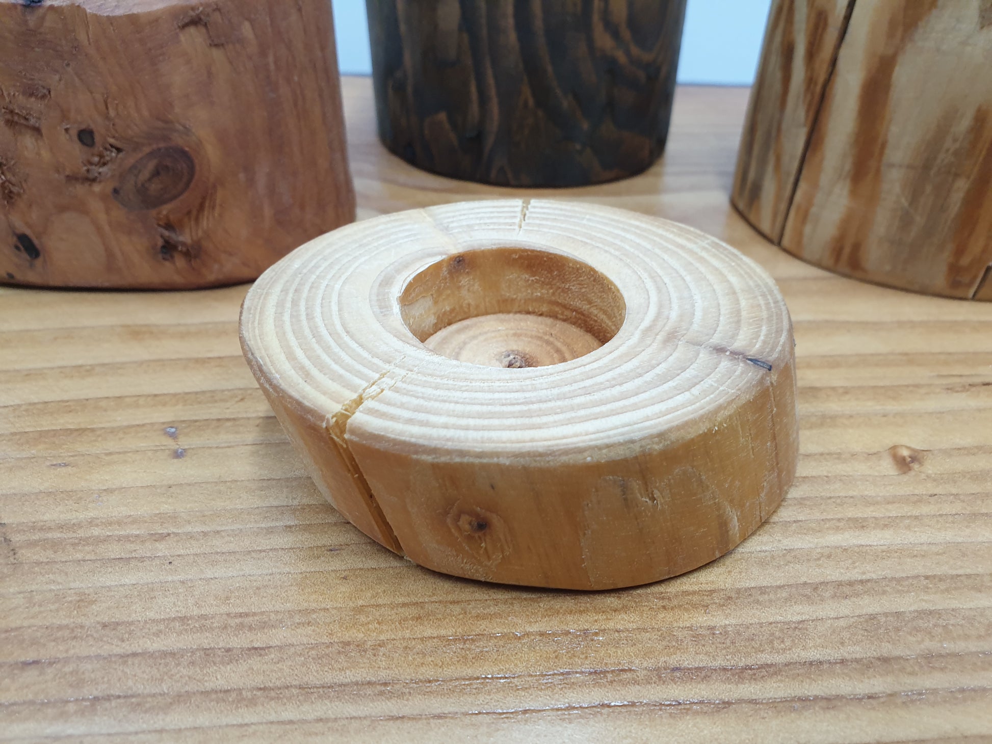 A natural wood finish short tea light holder