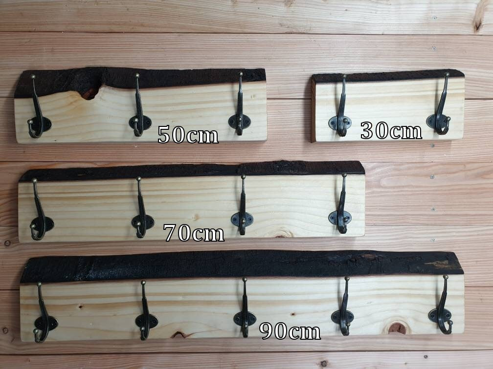 A photo of all 4 sizes of coat rack. with 30cm, 50cm, 70cm and 90cm clearly written on each one so potential buyers can see the obvious differences in  size, shape, character and hook capacity.