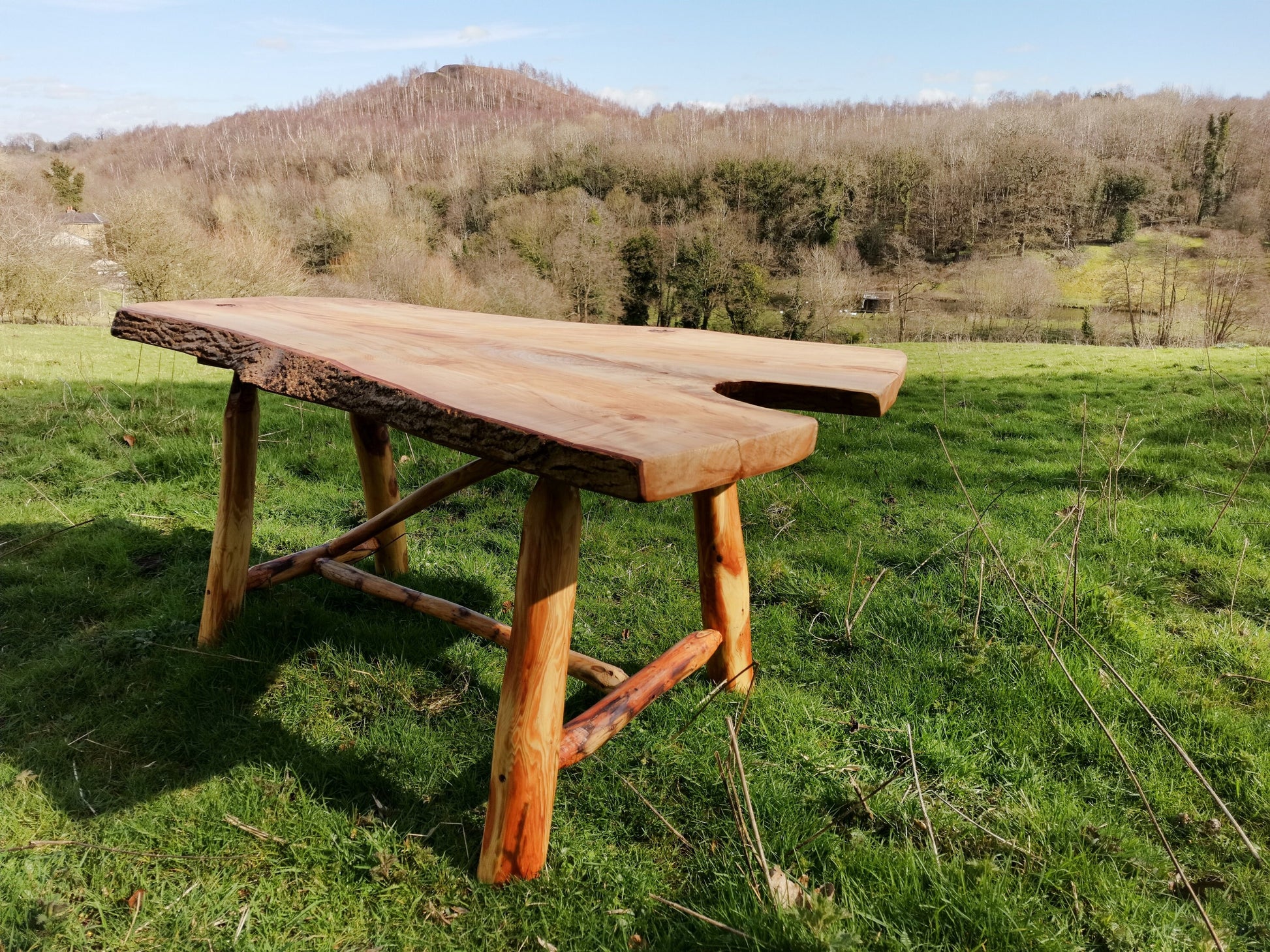 forked wooden table with view of welsh countryside