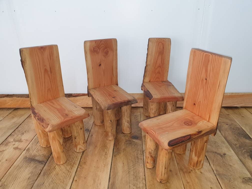 A collection of 4 similar kids thrones arranged together as a set.