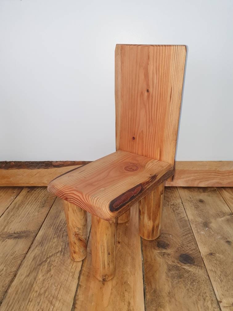 A tilted view of a kids throne against a studio background