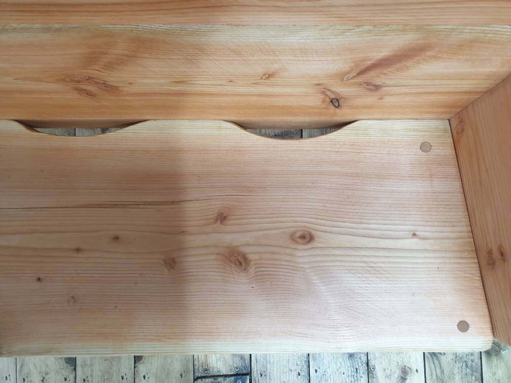 Closeup of the drainage holes to allow water to make its way out of the seat