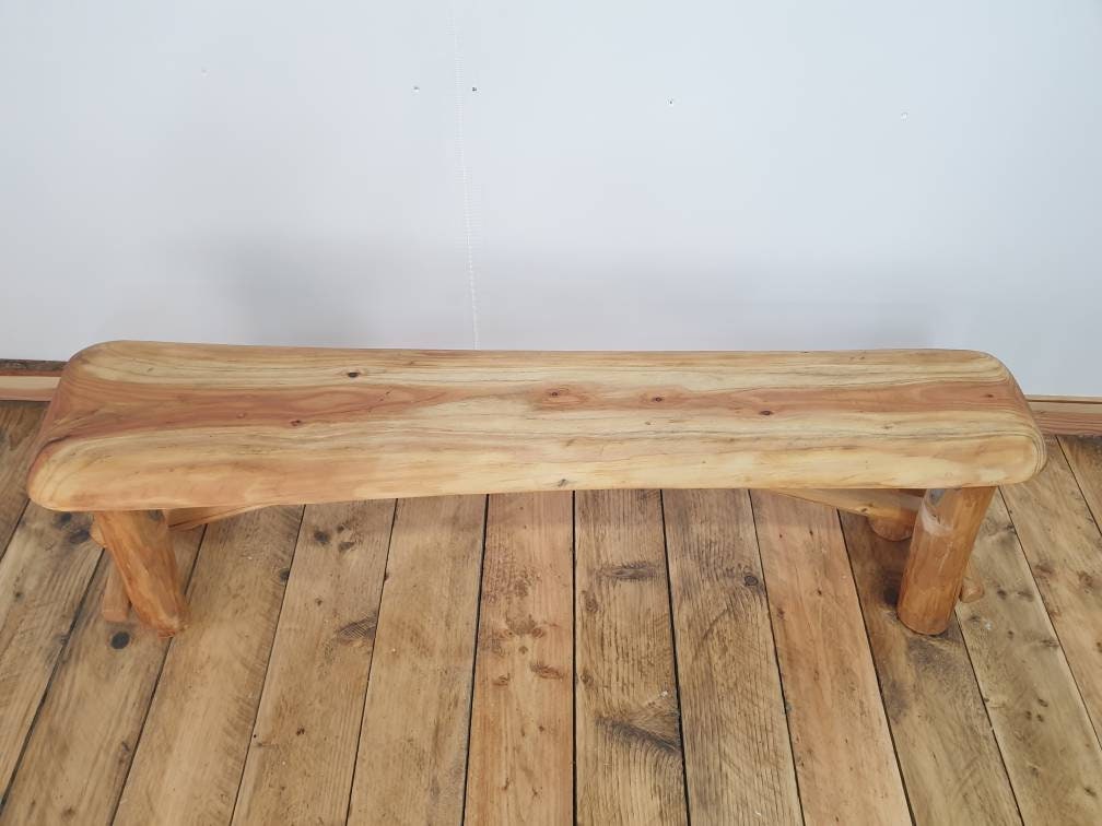 an overhead view of a foldable garden bench in a studio