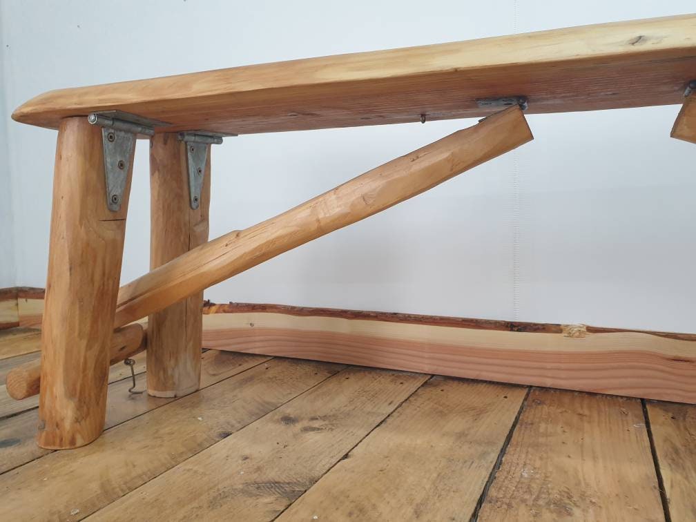 a view of the hinges and latching mechanism of a folding garden bench