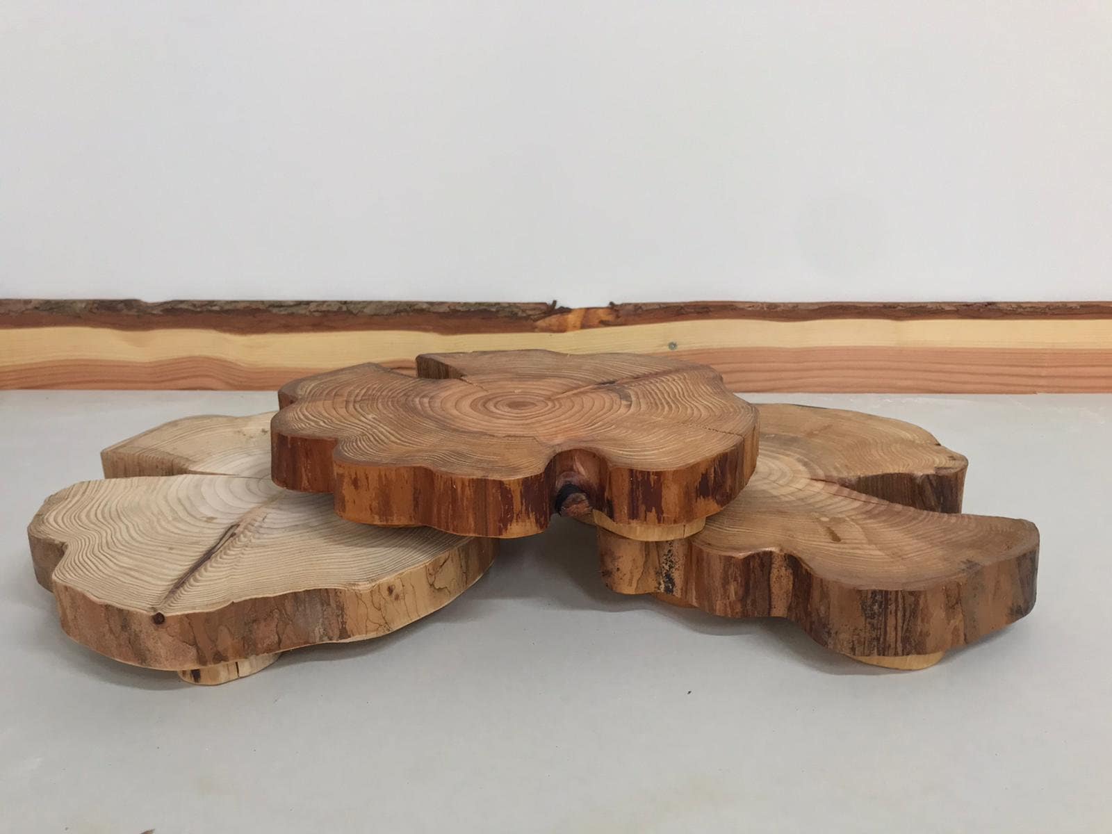 A stack of table centerpieces climbing all over each other with their stubby round feet.