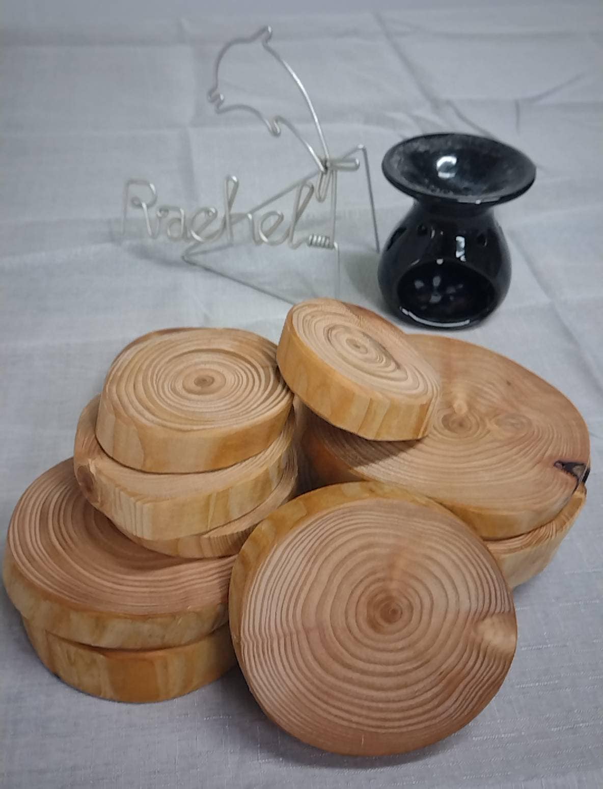 A pile of log ring coasters on a table