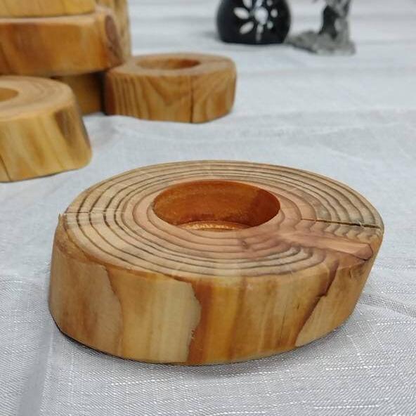 A closeup of a short log tea light holder