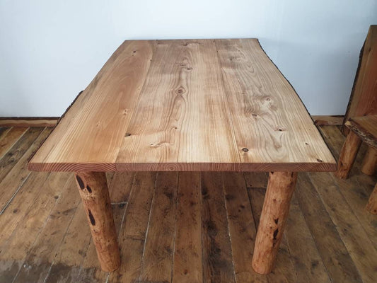 a farmhouse-style table, seen end on