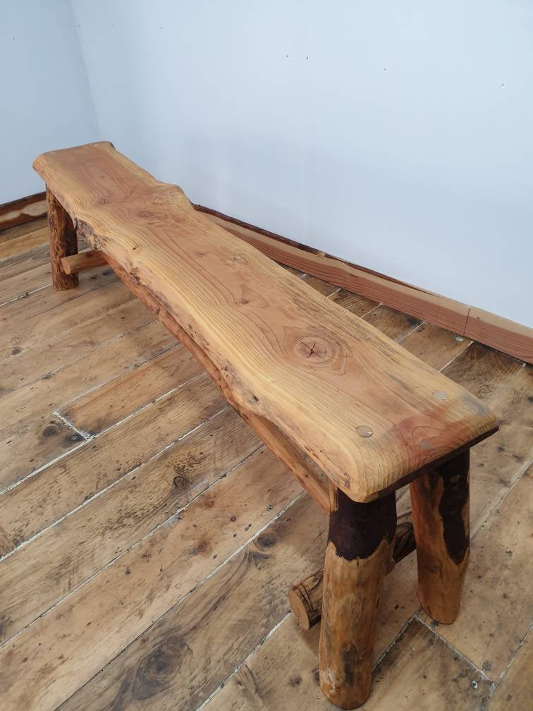 A long wooden bench treated with Danish Oil