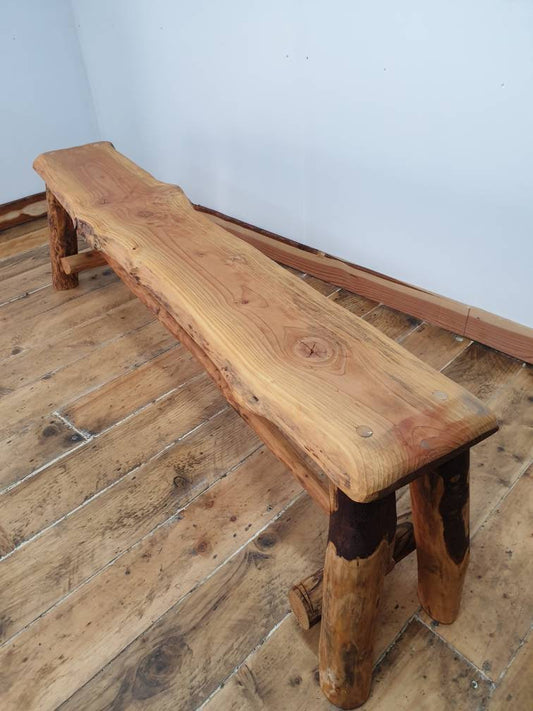 A long wooden bench treated with Danish Oil