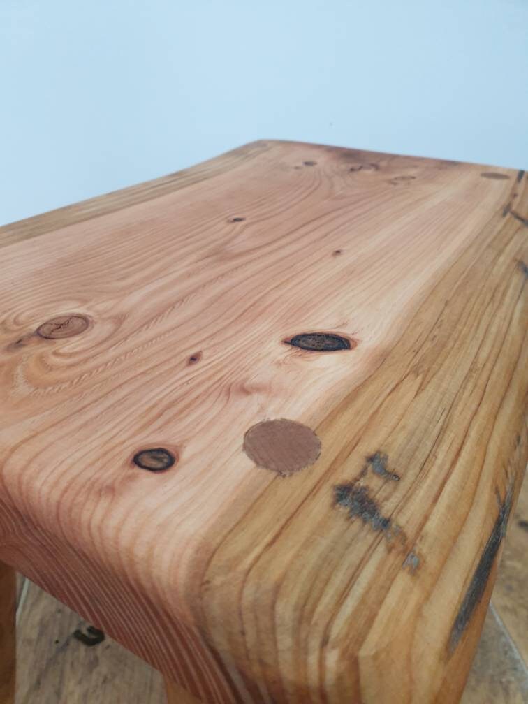 close up of the slab and dowel surface of a stool