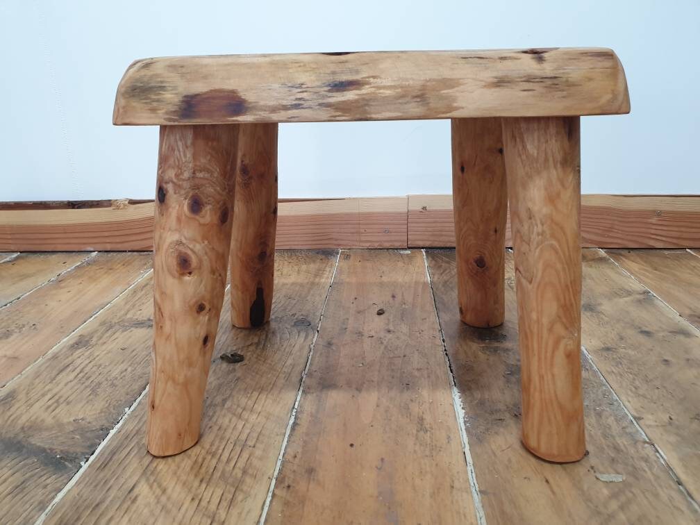 a front view of a wooden rectangular stool