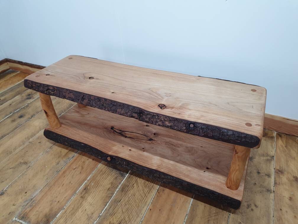 A view of a live-edge wooden coffee table unadorned