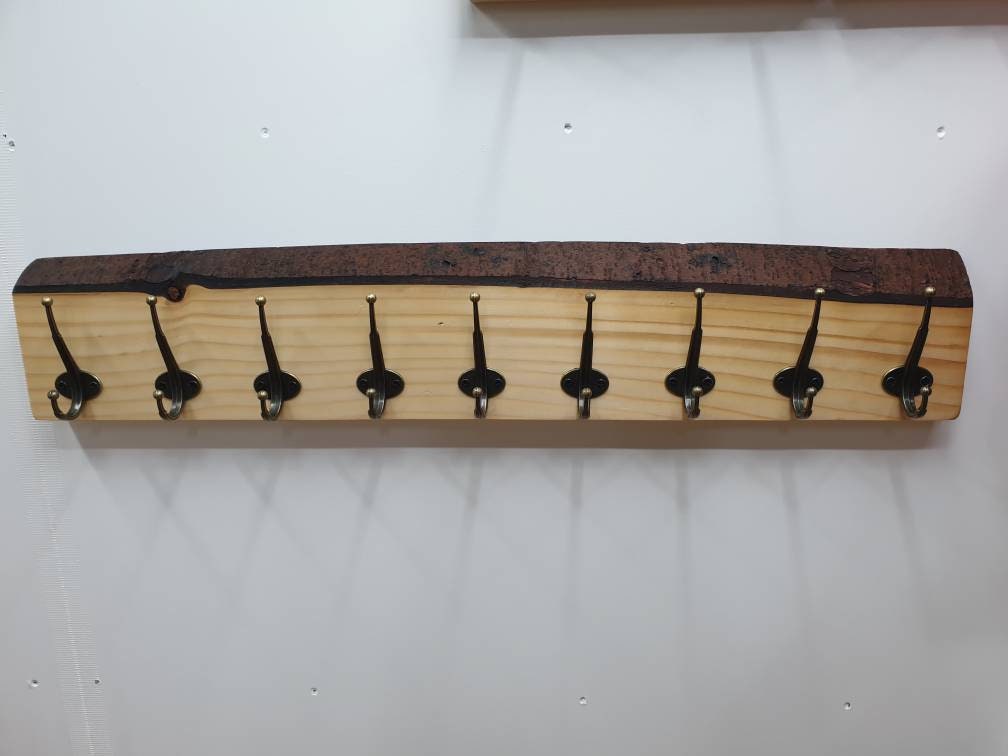 A photo of the previous 9 hook coat rack from a front aspect.