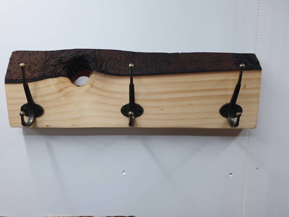 The previous 3 hook Spruce coat rack from the front aspect.