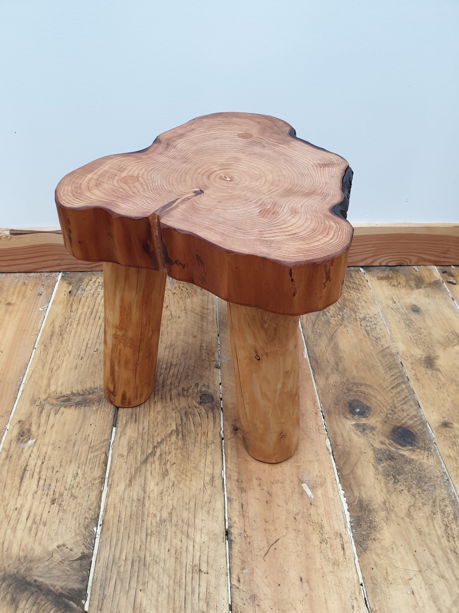 Another irregular shape stool with most of its bark missing. It has a small resin filled crack and great grain definition on the top.