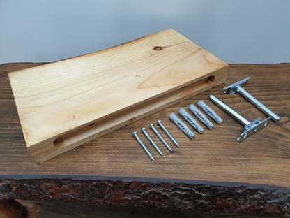 A floating shelf arranged together with its mounting hardware: two  brackets, four screws, and four wall plugs.