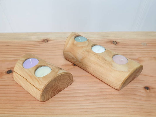 2 different sizes of half log tealight holders. 1 has holes for 2 tealights and the other has 3.